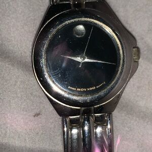 Vintage,  Movado museum black face ladies watch with crystal.